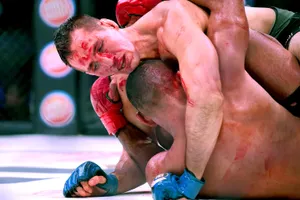 Rory Macdonald Grappling In The Ground Wallpaper