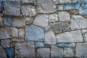 Rustic Stone Wall - Texture And Beauty Combined Wallpaper