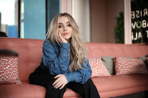 Sabrina Carpenter Denim Jacket Pose Wallpaper