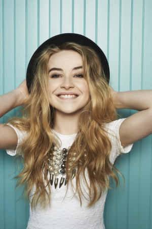 Sabrina Carpenter Smilingwith Hat Wallpaper