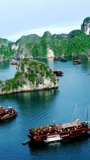Sailing Ships On Halong Bay In Vietnam Wallpaper