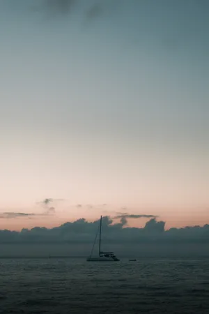 Sailing Under Pastel Twilight Wallpaper