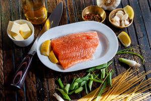 Salmon On Plate With Spices And Lemon Wallpaper