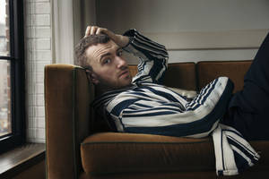 Sam Smith Cozy On Couch Wallpaper