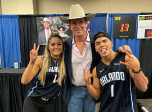 Sammy Guevara And Tay Melo In A Matching Jersey Top Wallpaper