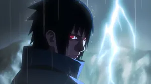Sasuke Uchiha With His Mangekyou Sharingan Wallpaper