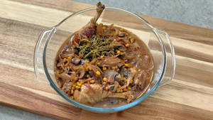 Saucy Coq Au Vin Served On A Glass Bowl Wallpaper