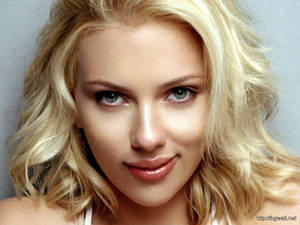 Scarlett Johansson With A Confident Smirk Wallpaper