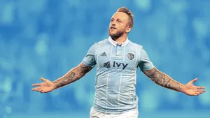 Scottish Professional Football Player Johnny Russell Blue Jersey Wallpaper