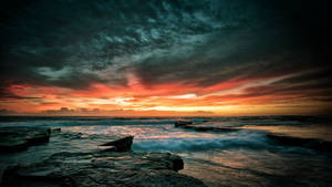 Sea With Rocks Beautiful Dark Background Wallpaper