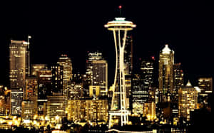 Seattle Skyline At Night With The Space Needle Wallpaper