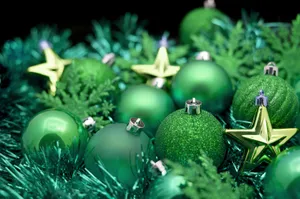 Selective Focus Photo Of Dark Green Christmas Decor Wallpaper