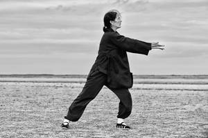 Serene Qi Gong Practitioner Wallpaper