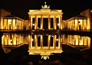 Serene Reflection Of The Brandenburg Gate Wallpaper