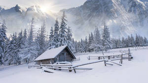 Serenity Amidst The Snow: An Enchanting Winter Retreat Wallpaper