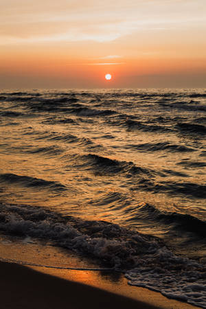 Setting Sun On Beach Android Wallpaper
