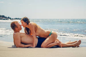 Sexual Couple At The Beach Wallpaper