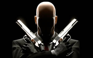 Shadowed Hitman Hd Guns Crossed Wallpaper