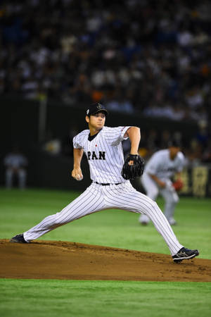 Shohei Ohtani In Baseball Action Wallpaper