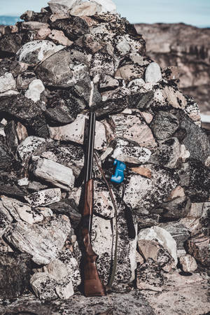 Shotgun Beside Rubble Wallpaper