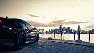 Show Off With The Stylish And Sleek Black Car Wallpaper