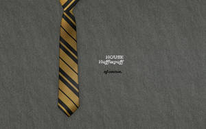 Show Your Colors With Embroidered House Hufflepuff Wallpaper