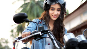 Shraddha Kapoor Motorbike Driving Wallpaper