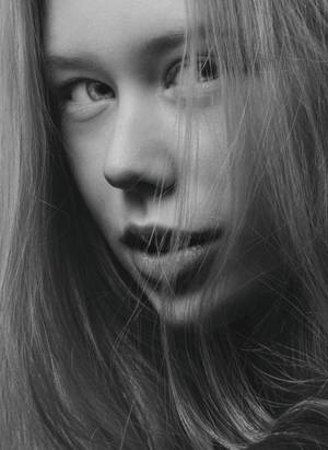 Shy Woman With Long Hair Wallpaper