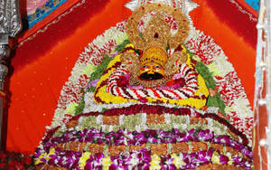 Shyam Baba Statue With Garlands Wallpaper