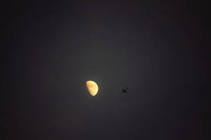 Silhouette Of Airplane Under Half Moon During Nighttime Wallpaper