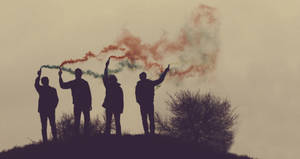 Silhouette Of People Holding Smoke Wallpaper