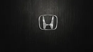 Silver Honda Logo In Solid Black Wallpaper