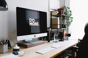 Silver Imac With Keyboard And Trackpad Inside Room Wallpaper