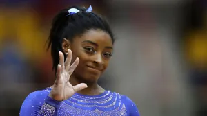 Simon Biles Hand Waving Wallpaper