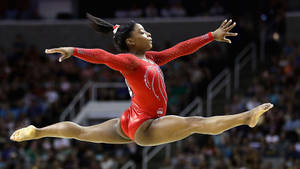 Simone Biles - A Champion American Artistic Gymnast Wallpaper