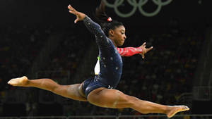 Simone Biles Huge Leap Wallpaper