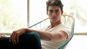 Sitting And Posing Handsome Man Wallpaper