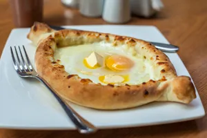 Sizzling Khachapuri Loaded With Melted Cheese And Egg Wallpaper