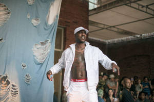 Skepta Wearing A White Jacket Wallpaper