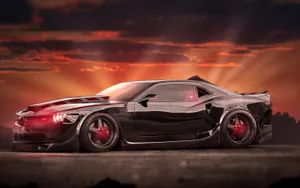 Sleek Black Camaro Muscle Car Wallpaper