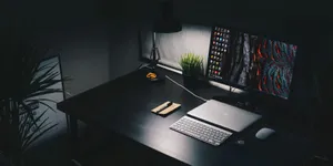 Sleek Black Desk Still Life Wallpaper