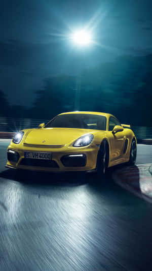 Sleek Black Porsche On City Streets Wallpaper