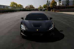 Sleek_ Black_ Sports_ Car_ Parked_ Outdoors.jpg Wallpaper