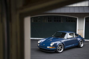 Sleek Blue Singer Porsche Wallpaper