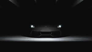 Sleek Oled Monitor On A Modern Desk Wallpaper