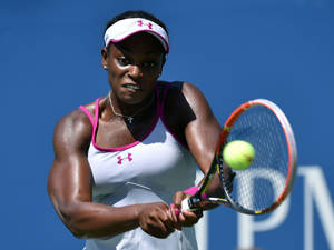 Sloane Stephens Hitting A Tennis Ball Wallpaper