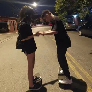 Smiling Boy Wearing A Stylish Striped Shirt Wallpaper