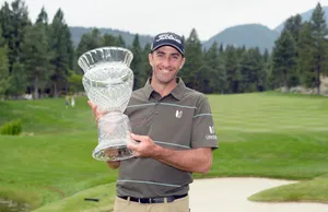 Smiling Geoff Ogilvy Carrying His Trophy Wallpaper