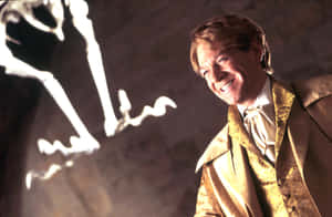 Smiling Man With Magical Creature Shadow Wallpaper