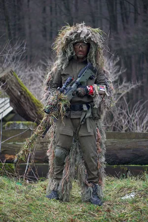 Sniper_in_ Ghillie_ Suit_with_ Rifle.jpg Wallpaper